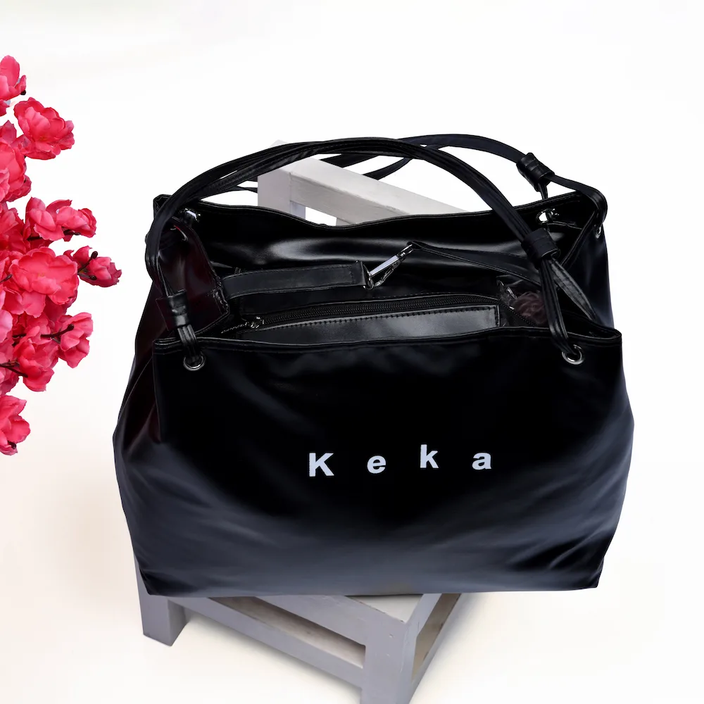 Ladies Keka bag with flower in background