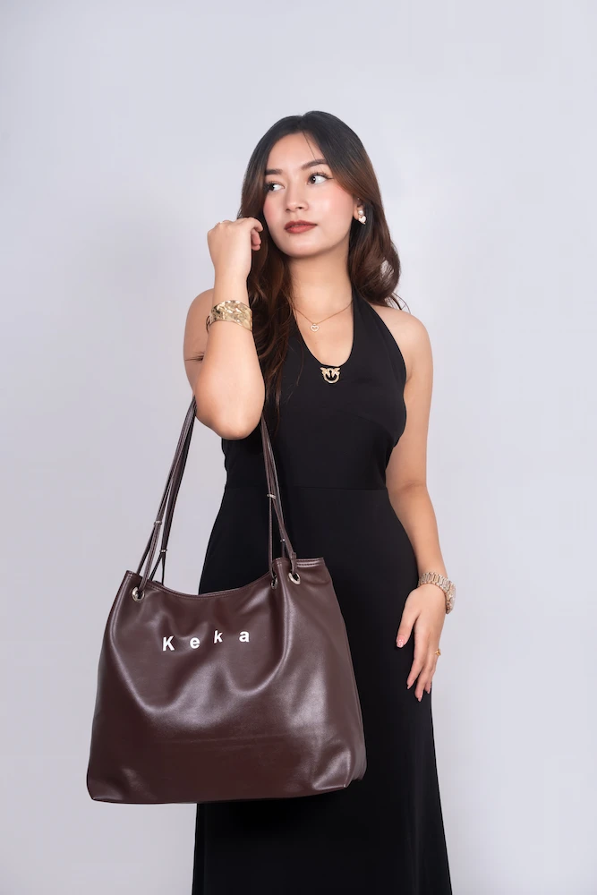 Coffee Color Ladies Keka Bag in models hand